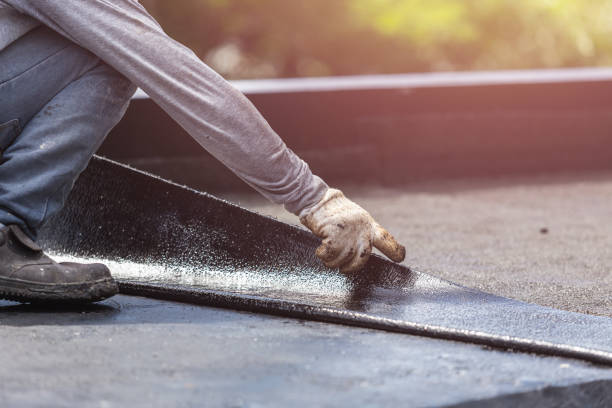 Professional Basement Waterproofing technician working in Madison, VA